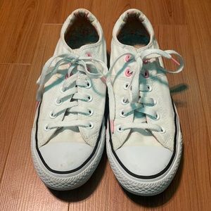 lightly used white and floral converse